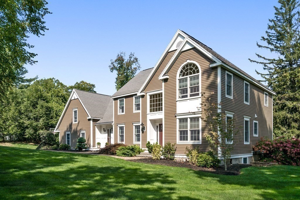 1 Barnbridge Circle Framingham, MA 01701 - Photo 2 of 42 a front view of a house with a yard and trees