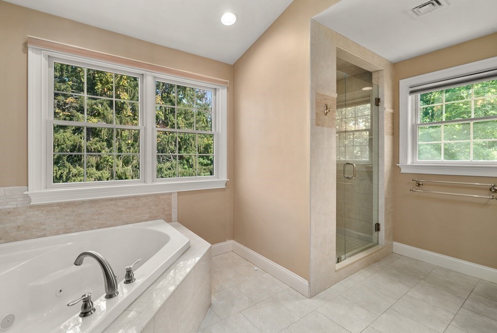 1 Barnbridge Circle Framingham, MA 01701 - Photo 22 of 42 a view of a bath tub sitting in a bathroom next to a window