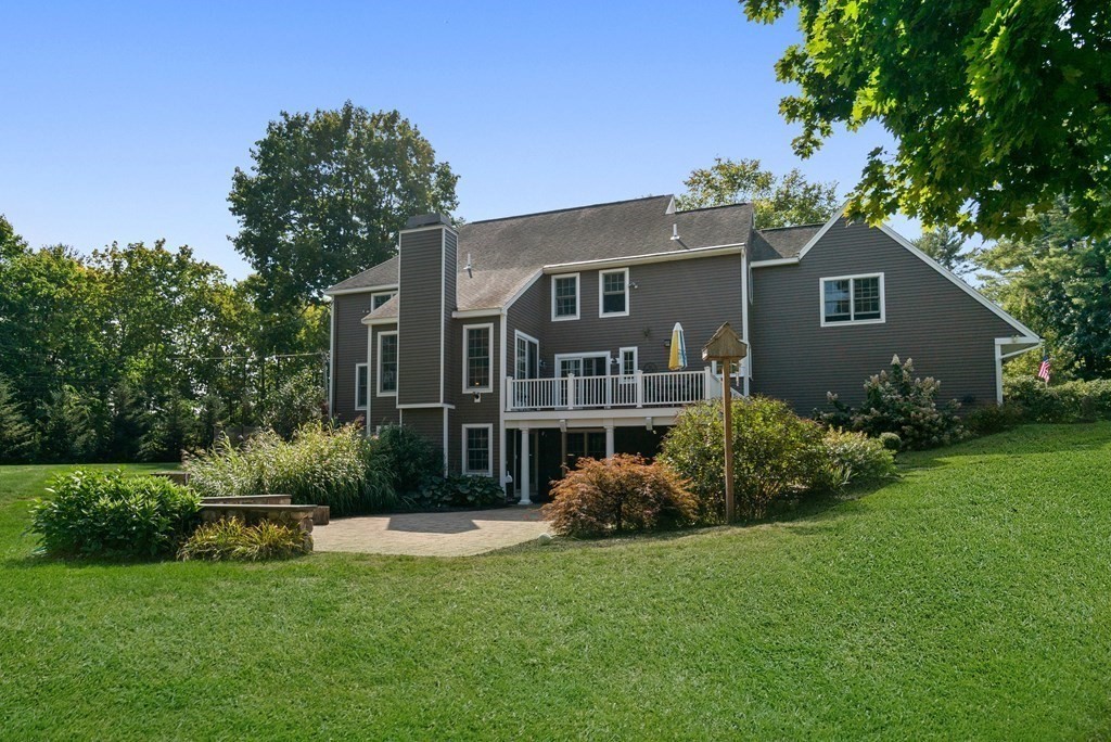 1 Barnbridge Circle Framingham, MA 01701 - Photo 6 of 42 a front view of a house with a yard and potted plants