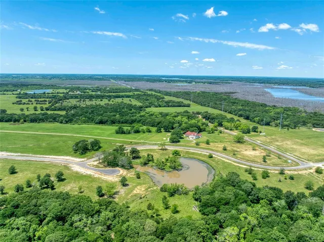 a view of an ocean and a yard