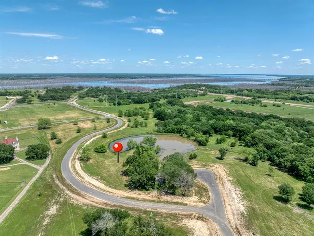 a view of a swimming pool and a yard