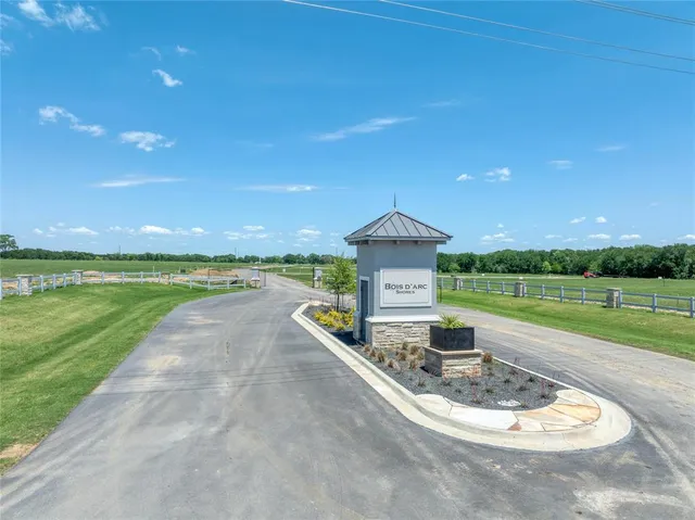 a lake view with a big yard