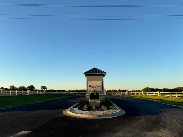 a view of a swimming pool with a yard