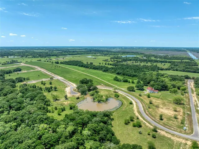 a view of a swimming pool with a yard