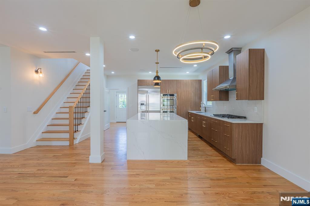 24 Ryder Road Fair Lawn, NJ 07410 - Photo 18 of 19 a view of kitchen with furniture and wooden floor