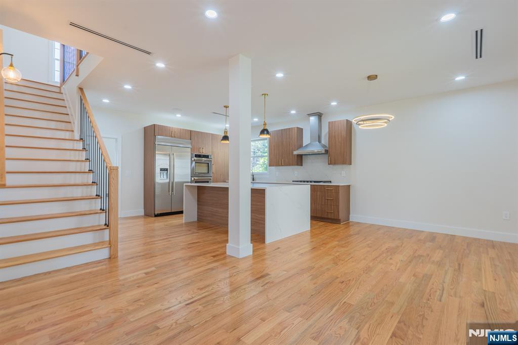 24 Ryder Road Fair Lawn, NJ 07410 - Photo 19 of 19 a view of kitchen with kitchen island stainless steel appliances cabinets and wooden floor