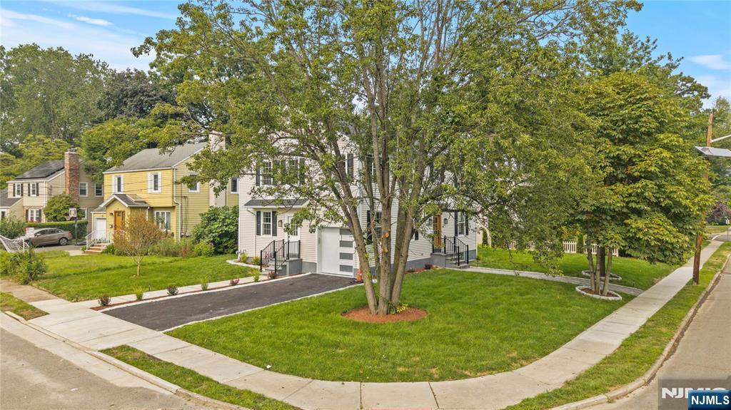 24 Ryder Road Fair Lawn, NJ 07410 - Photo 2 of 19 a view of a park with large trees