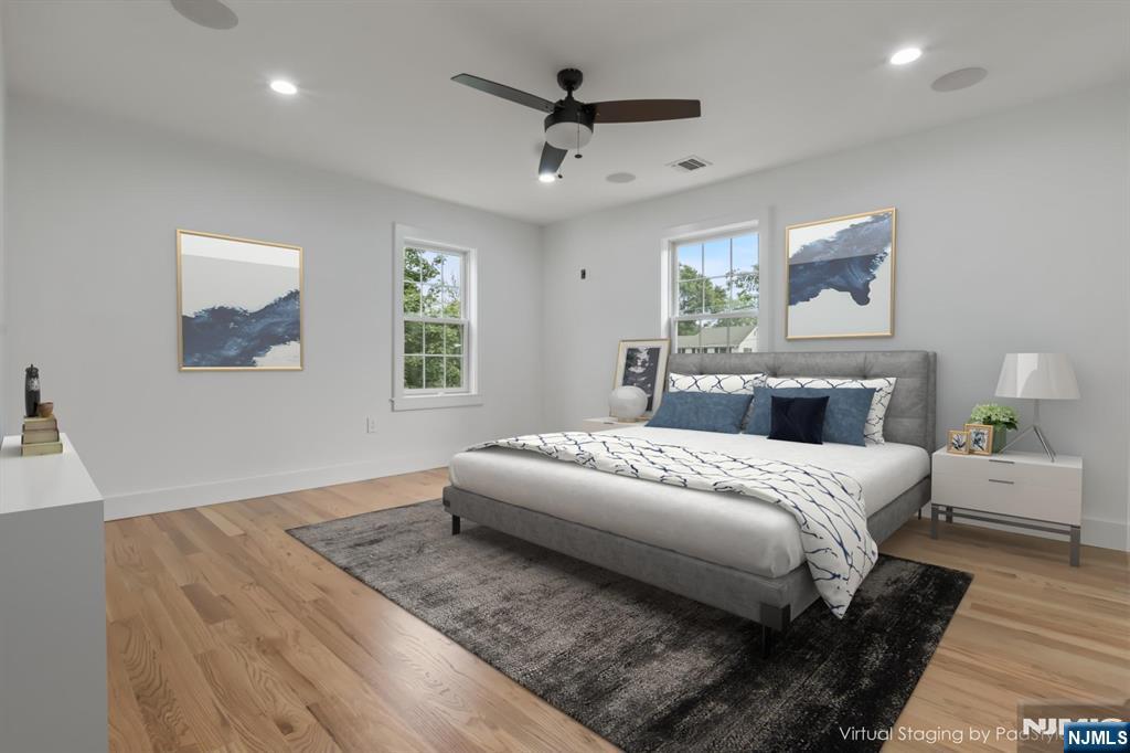 24 Ryder Road Fair Lawn, NJ 07410 - Photo 8 of 19 a spacious bedroom with a bed and a window