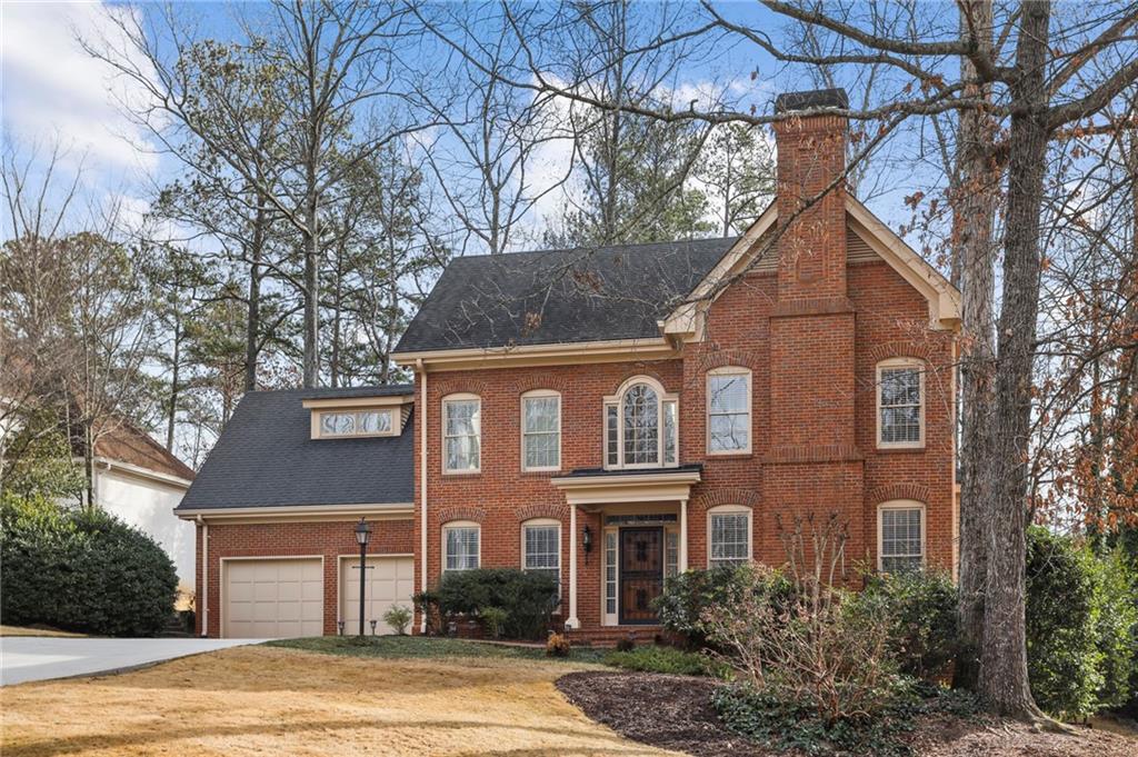 Beautiful Sandy Springs all brick home on level lot.