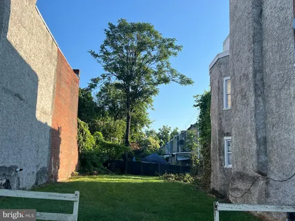 front view of a house with a garden