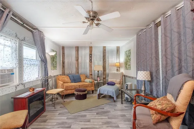 a living room with furniture and a window