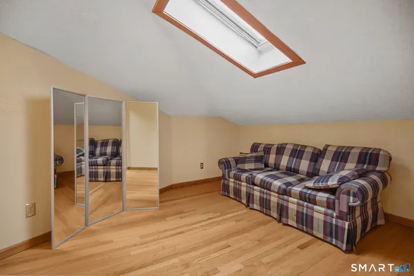 walk in closet with wooden floor