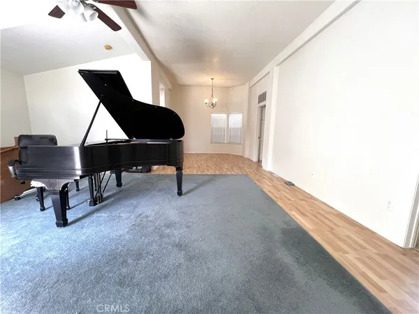 a living room with furniture and a lamp