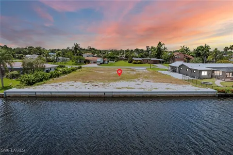 a view of a wooden terrace with lake view