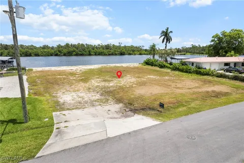a view of a lake with houses in the back