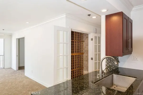 a view of a hallway with dining area