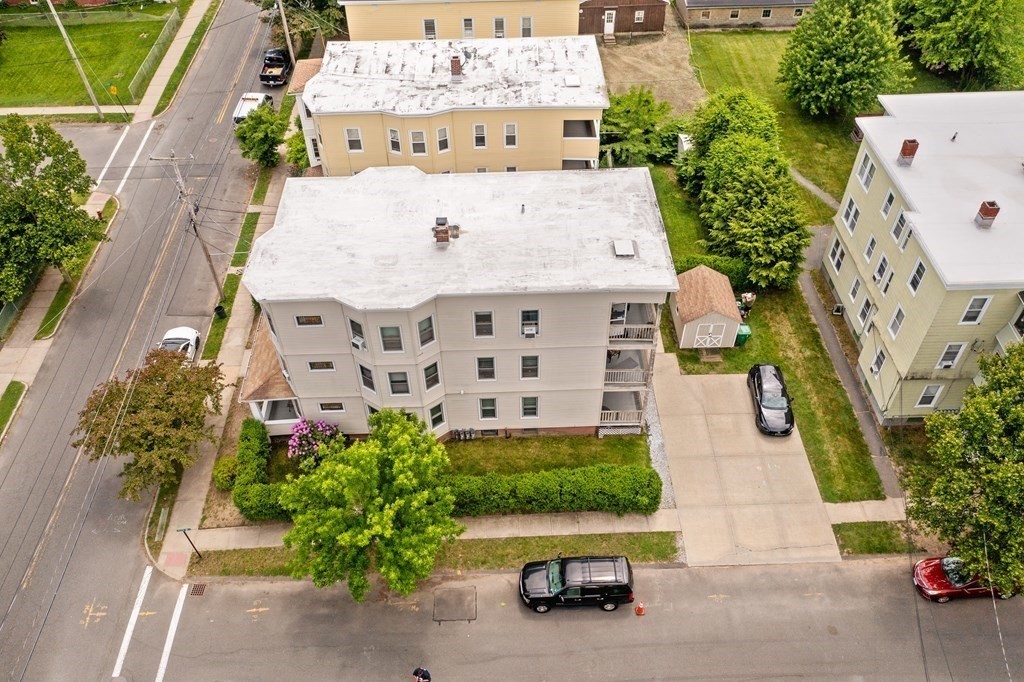 an aerial view of a house with outdoor space