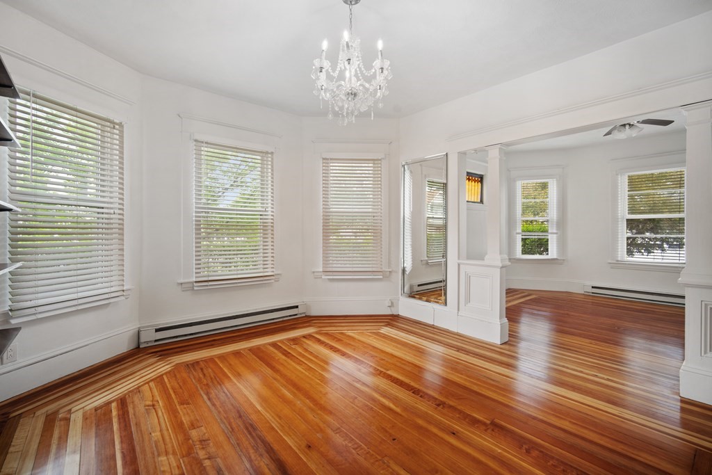 40 Orchard Street Chicopee, MA 01013 - Photo 15 of 34 a view of an empty room with wooden floor and a window