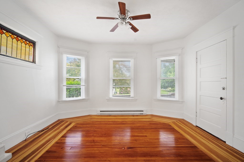 40 Orchard Street Chicopee, MA 01013 - Photo 17 of 34 a view of empty room with wooden floor and fan