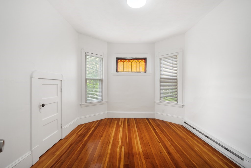 40 Orchard Street Chicopee, MA 01013 - Photo 19 of 34 a view of a room with wooden floor and windows
