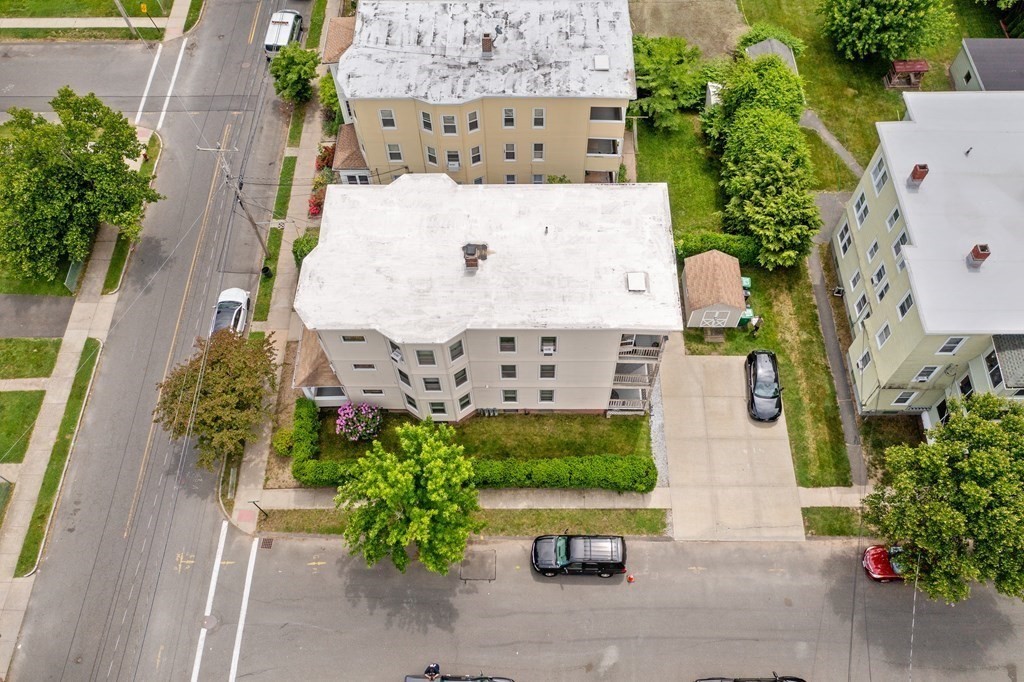 40 Orchard Street Chicopee, MA 01013 - Photo 2 of 34 an aerial view of a house with a yard and garden