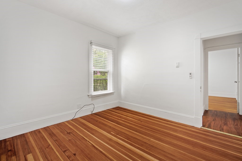40 Orchard Street Chicopee, MA 01013 - Photo 21 of 34 an empty room with wooden floor and windows