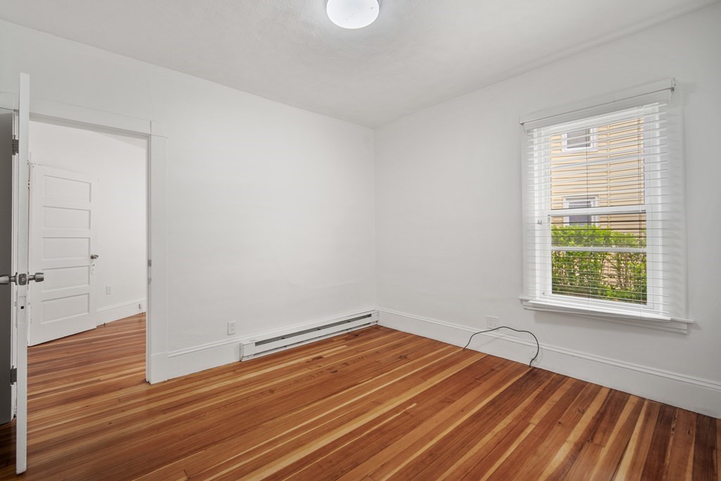 40 Orchard Street Chicopee, MA 01013 - Photo 22 of 34 a view of a room with wooden floor and windows