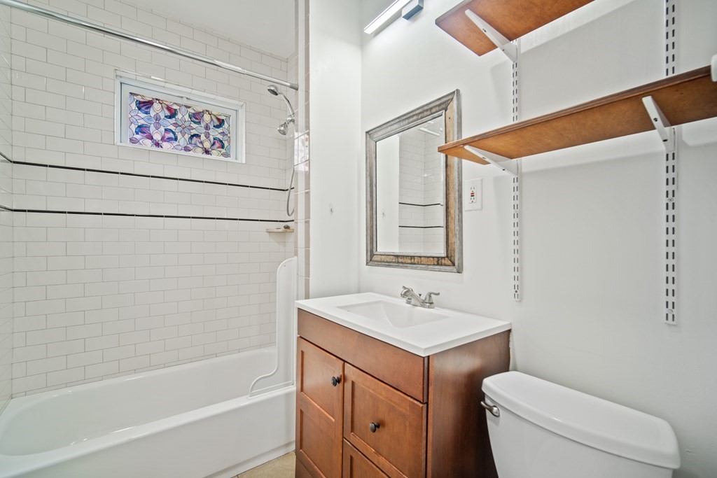 40 Orchard Street Chicopee, MA 01013 - Photo 23 of 34 a bathroom with a sink a toilet and a bathtub