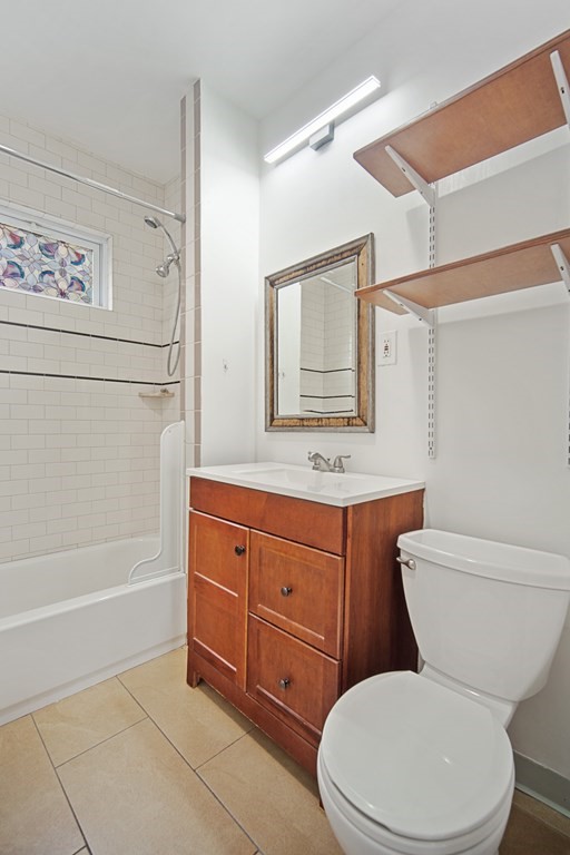 40 Orchard Street Chicopee, MA 01013 - Photo 24 of 34 a bathroom with a toilet sink and mirror