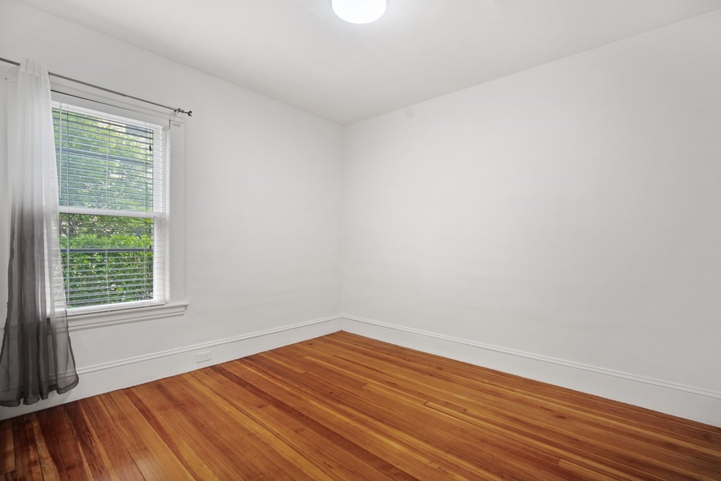 40 Orchard Street Chicopee, MA 01013 - Photo 25 of 34 a view of an empty room with wooden floor and a window