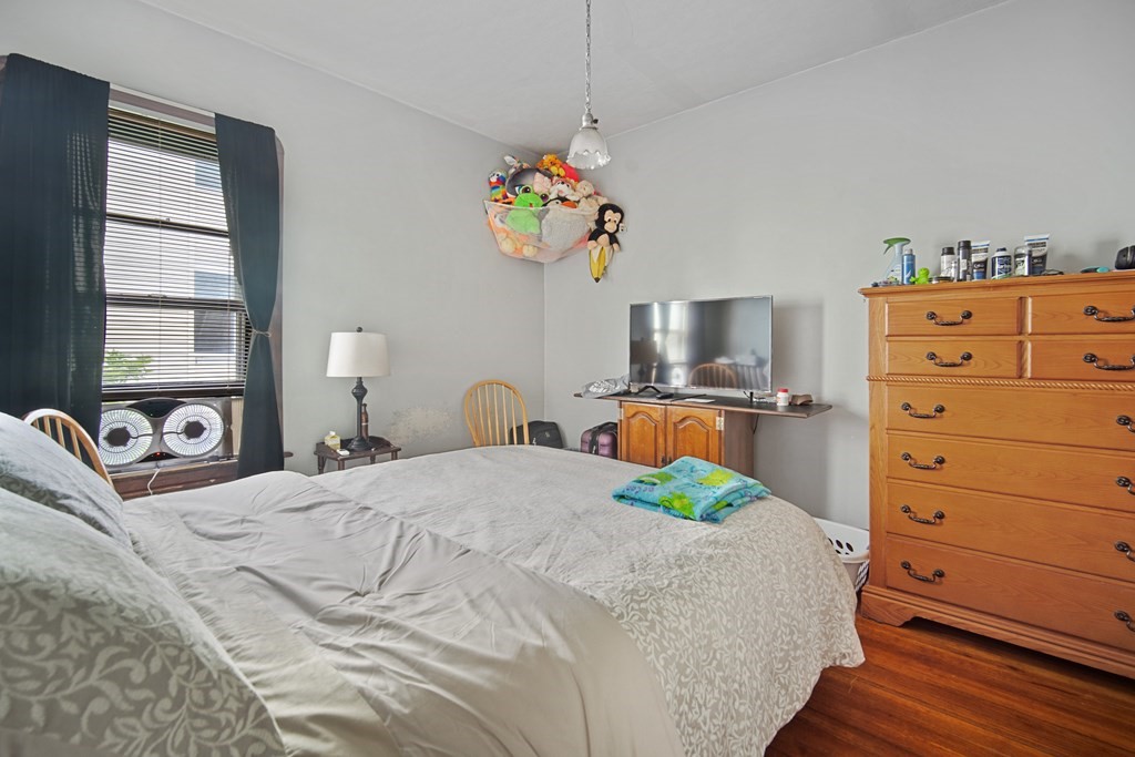 40 Orchard Street Chicopee, MA 01013 - Photo 29 of 34 a bedroom with a bed and a dresser