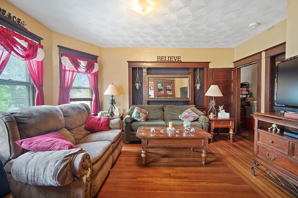 40 Orchard Street Chicopee, MA 01013 - Photo 31 of 34 a living room with furniture and a flat screen tv