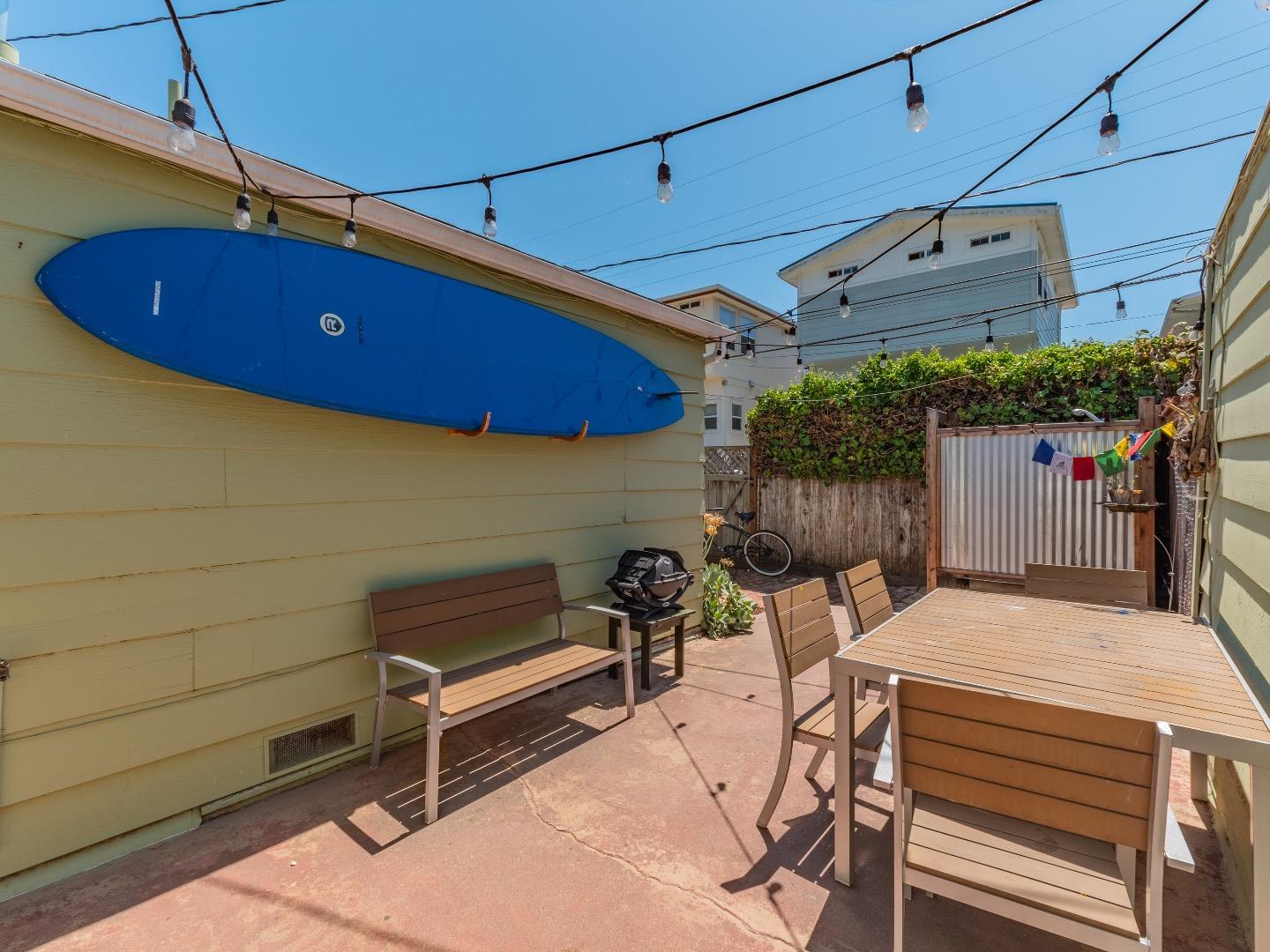 146 Hainline Road Aptos, CA 95003 - Photo 18 of 45 a view of a patio with table and chairs with wooden floor