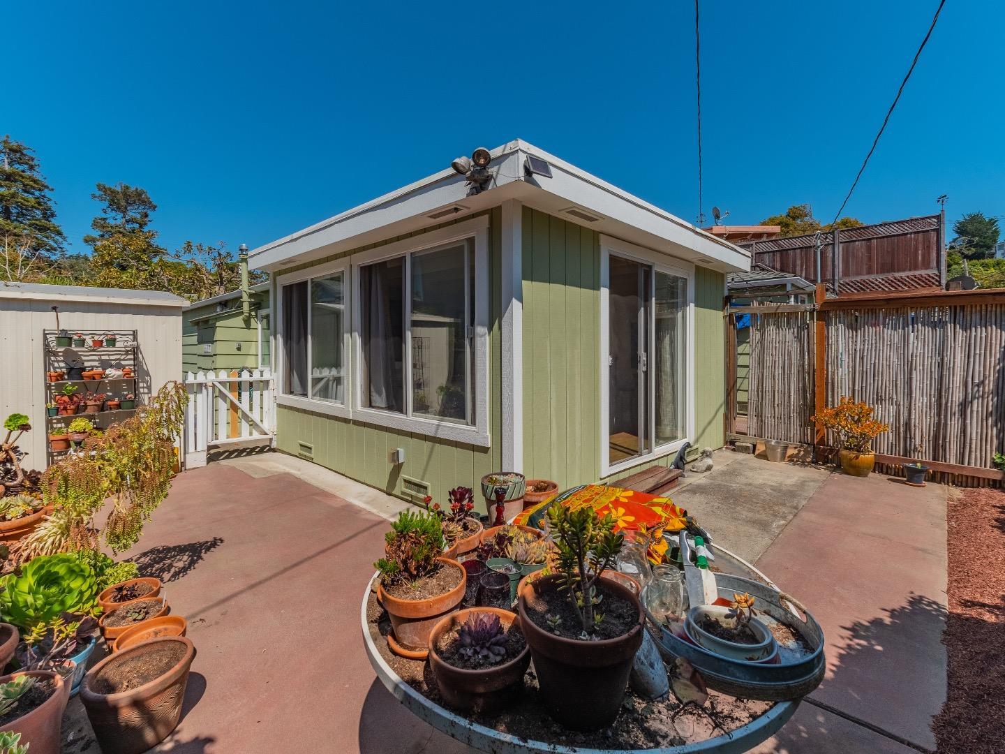 146 Hainline Road Aptos, CA 95003 - Photo 28 of 45 a view of a backyard with chair and tables