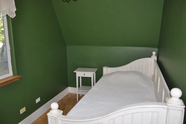 a balcony with table and chairs