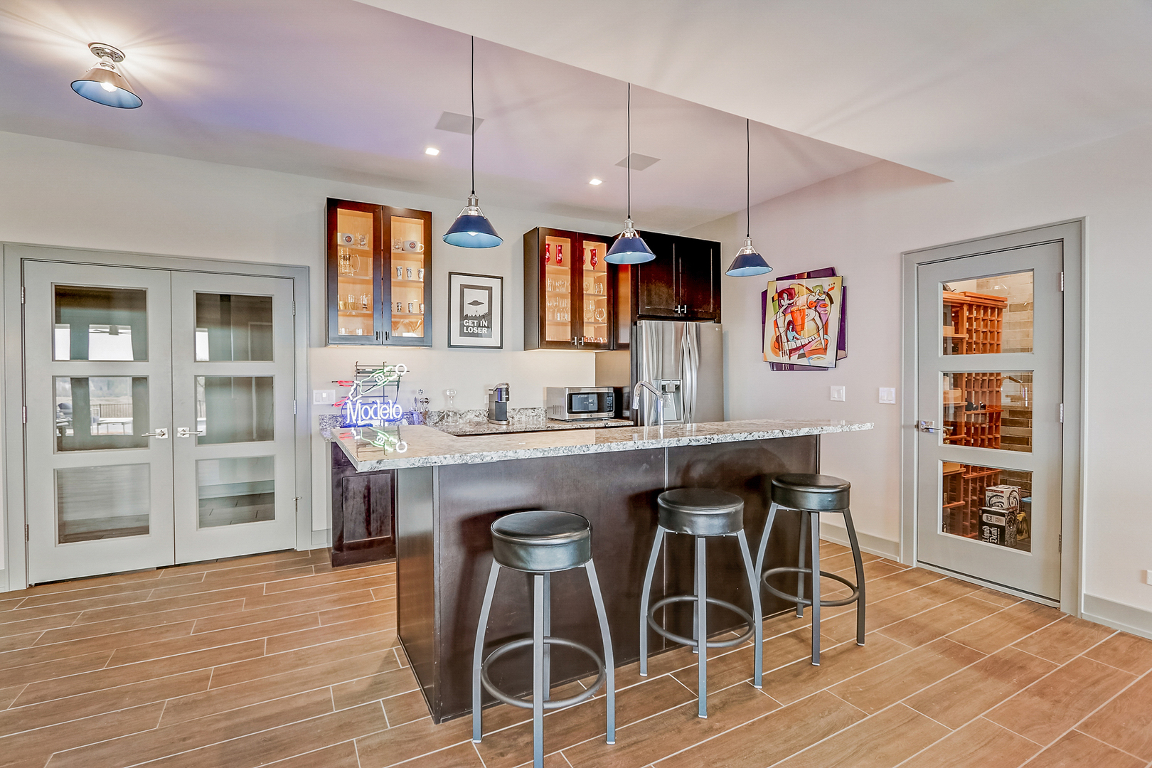 1812 Hunters Ridge Lane Sugar Grove, IL 60554 - Photo 28 of 45 a dining room with stainless steel appliances kitchen island granite countertop a stove a table and chairs