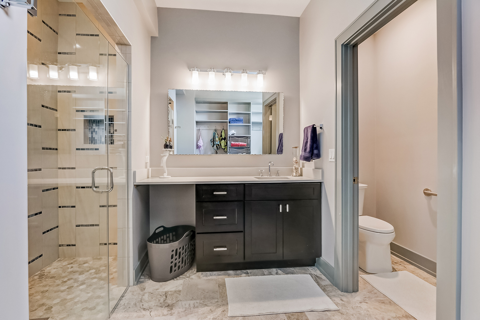 1812 Hunters Ridge Lane Sugar Grove, IL 60554 - Photo 31 of 45 a bathroom with a sink a toilet and shower