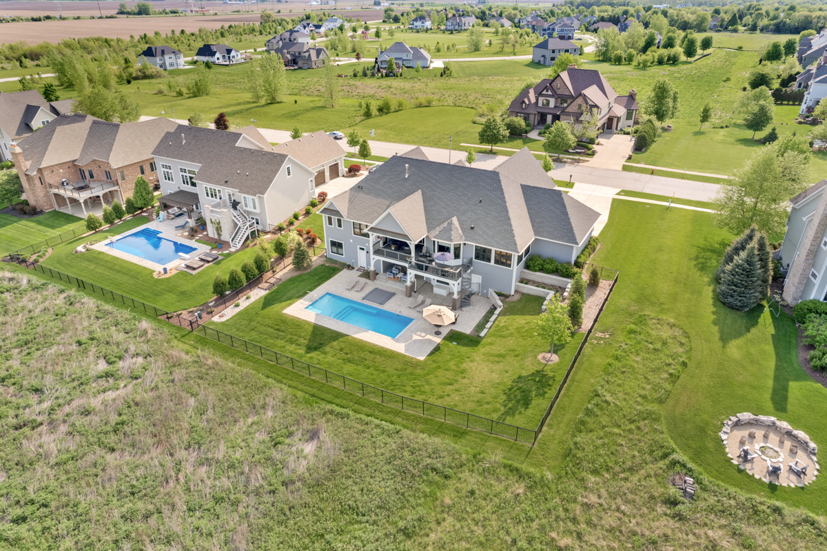 1812 Hunters Ridge Lane Sugar Grove, IL 60554 - Photo 41 of 45 an aerial view of a house with a big yard