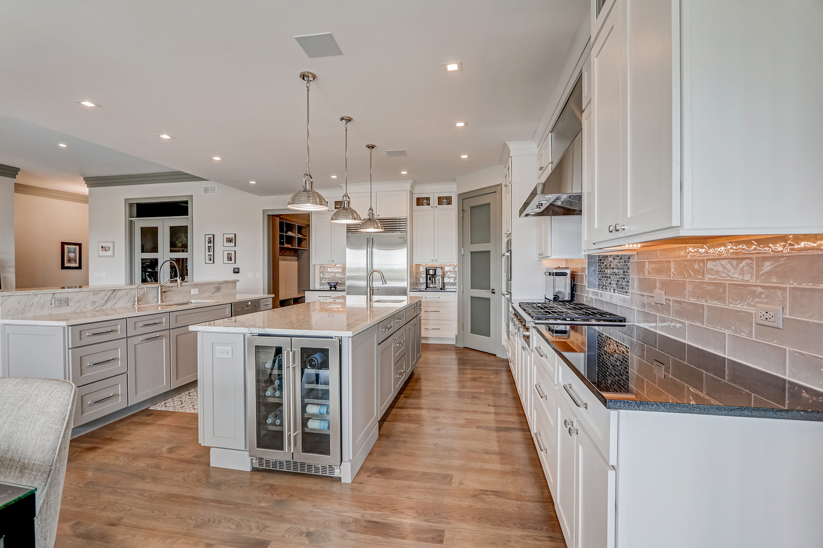 1812 Hunters Ridge Lane Sugar Grove, IL 60554 - Photo 8 of 45 a large kitchen with stainless steel appliances granite countertop a sink and a stove