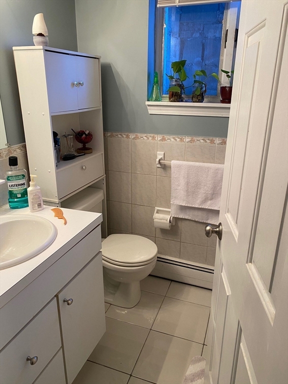 1 Salem Street, Unit B1 Wakefield, MA 01880 - Photo 3 of 12 a bathroom with a toilet sink and mirror