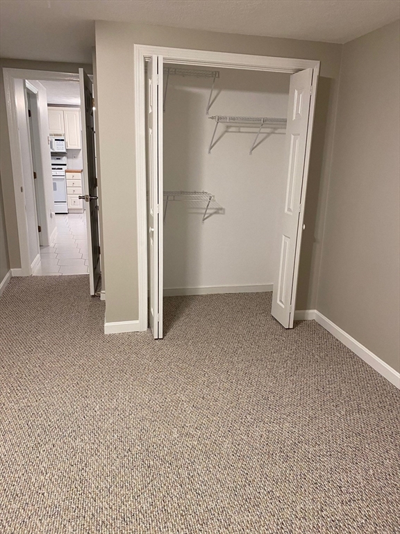 1 Salem Street, Unit B1 Wakefield, MA 01880 - Photo 6 of 12 an empty room with closet