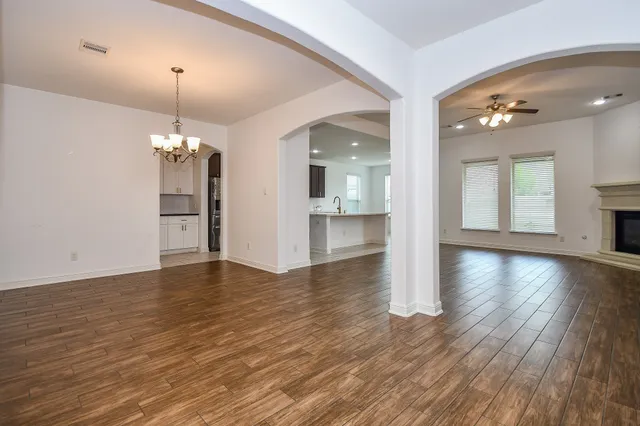 a view of a kitchen with a sink and a fireplace