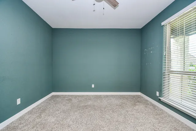 a view of a chandelier in an empty room