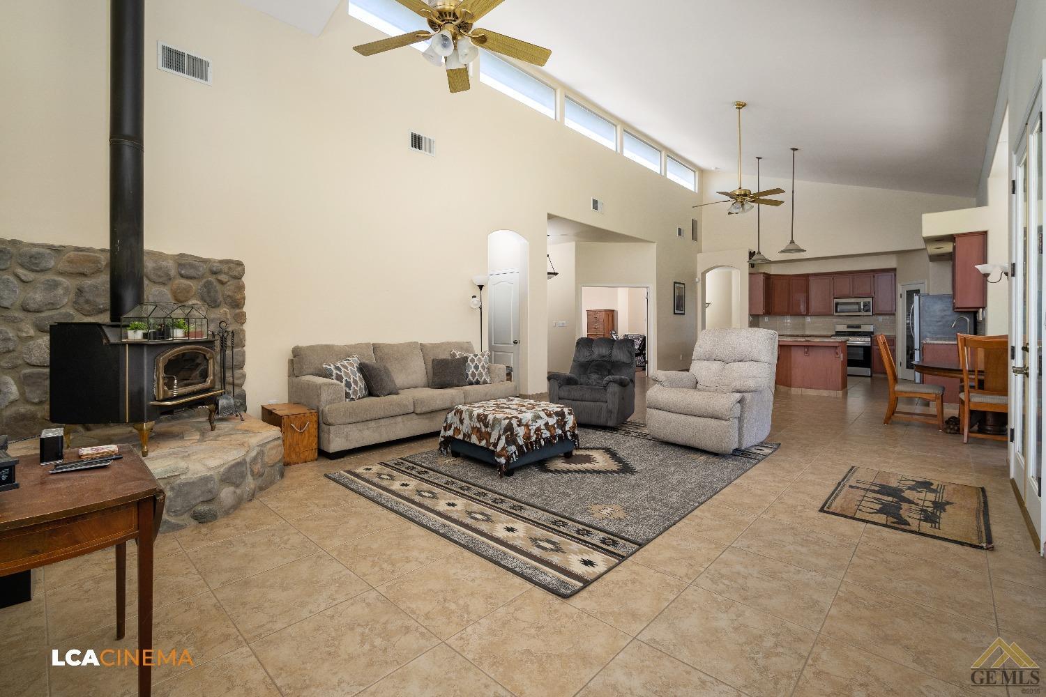 Undisclosed Address Bakersfield, CA 93314 - Photo 12 of 33 a living room with furniture and a fireplace