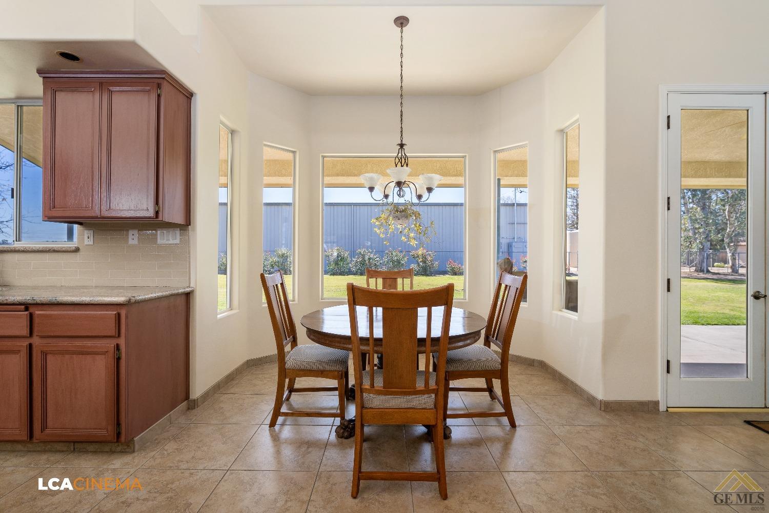 Undisclosed Address Bakersfield, CA 93314 - Photo 13 of 33 a view of a dining room with furniture window and outside view