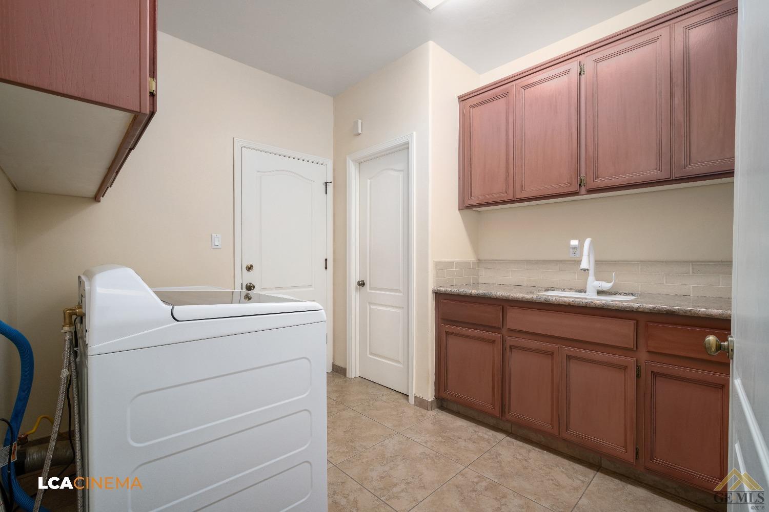 Undisclosed Address Bakersfield, CA 93314 - Photo 18 of 33 a bathroom with a sink and a mirror