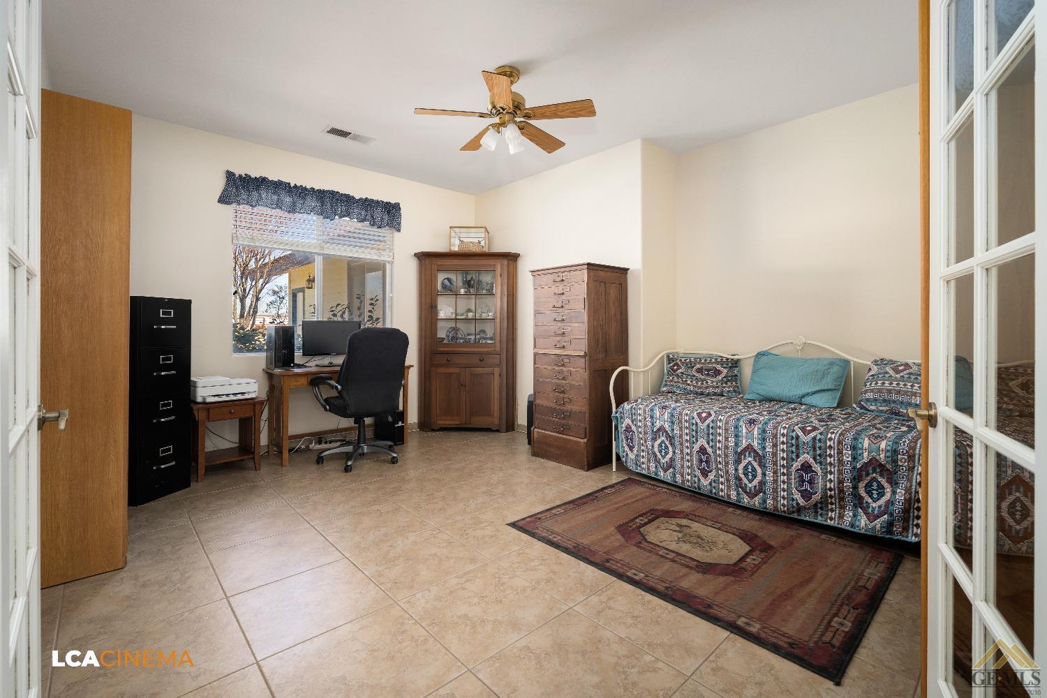 Undisclosed Address Bakersfield, CA 93314 - Photo 19 of 33 a living room with furniture and a chandelier