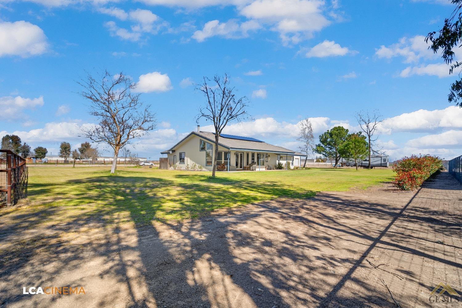 Undisclosed Address Bakersfield, CA 93314 - Photo 27 of 33 a view of a swimming pool with a yard