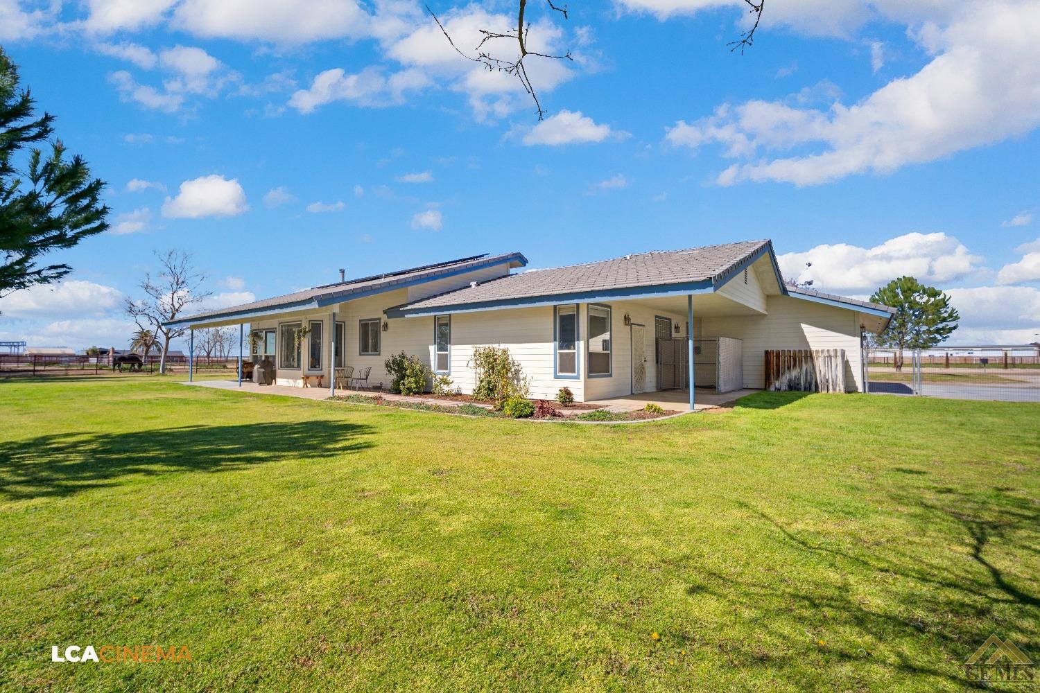 Undisclosed Address Bakersfield, CA 93314 - Photo 29 of 33 a front view of house with yard and swimming pool