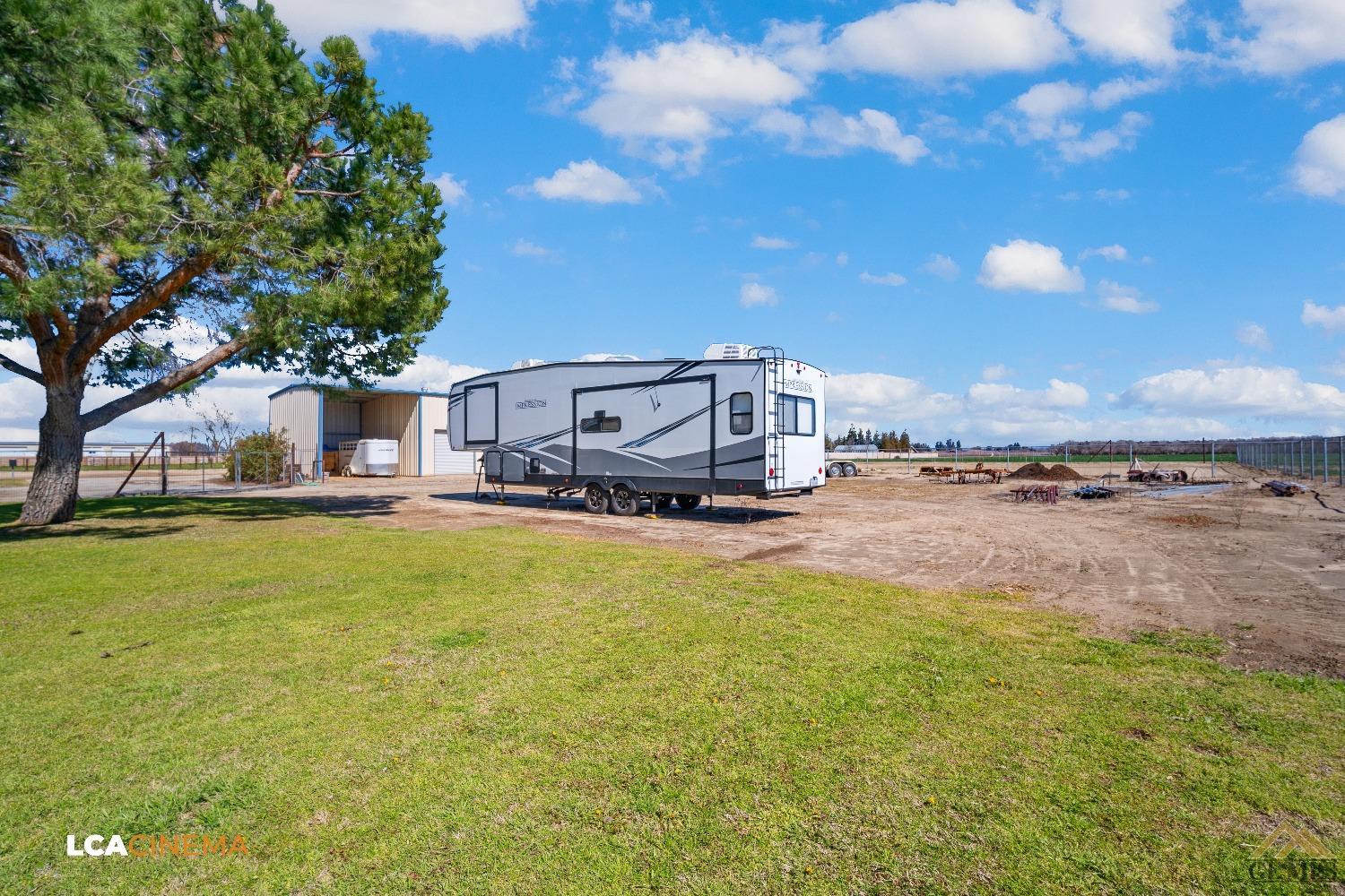 Undisclosed Address Bakersfield, CA 93314 - Photo 31 of 33 a swimming pool with outdoor seating and yard